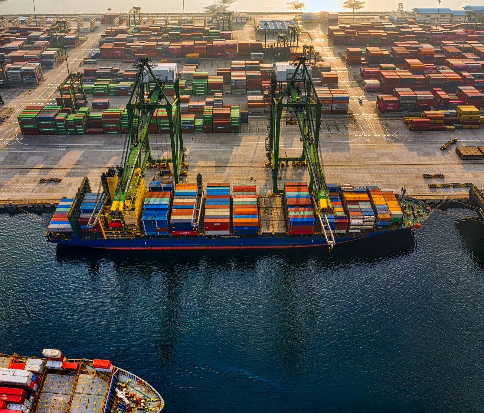 Aerial view of a container ship being loaded at a shipping port