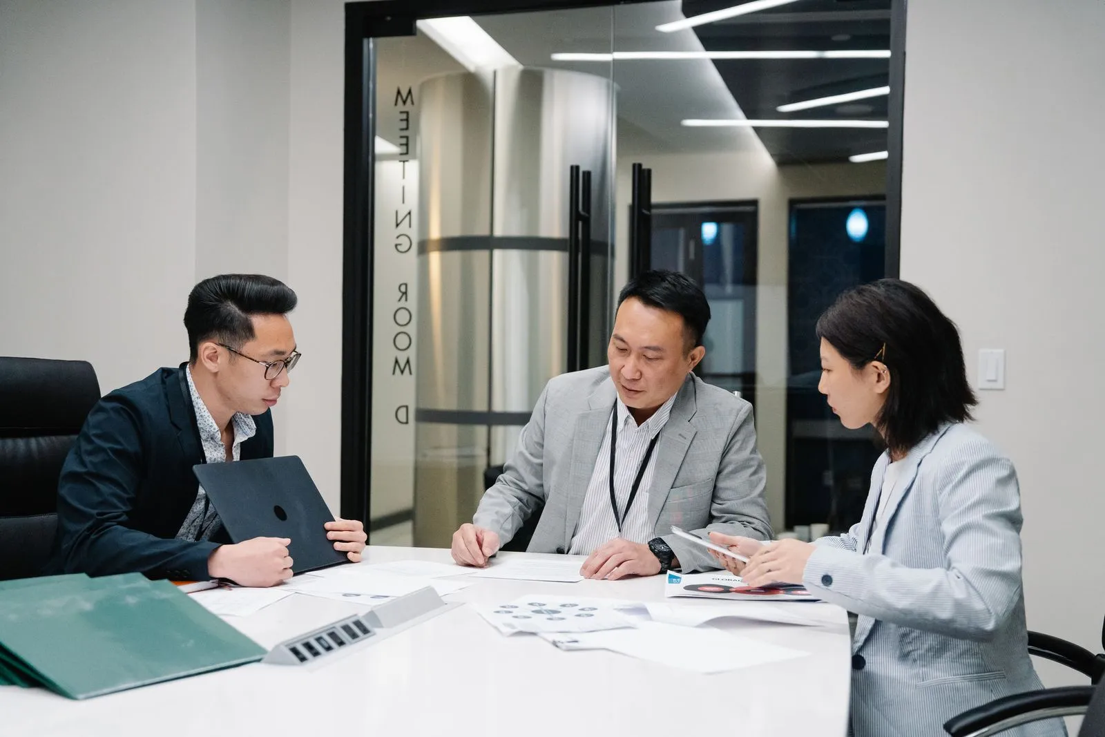 A small senior team in a focused strategy discussion