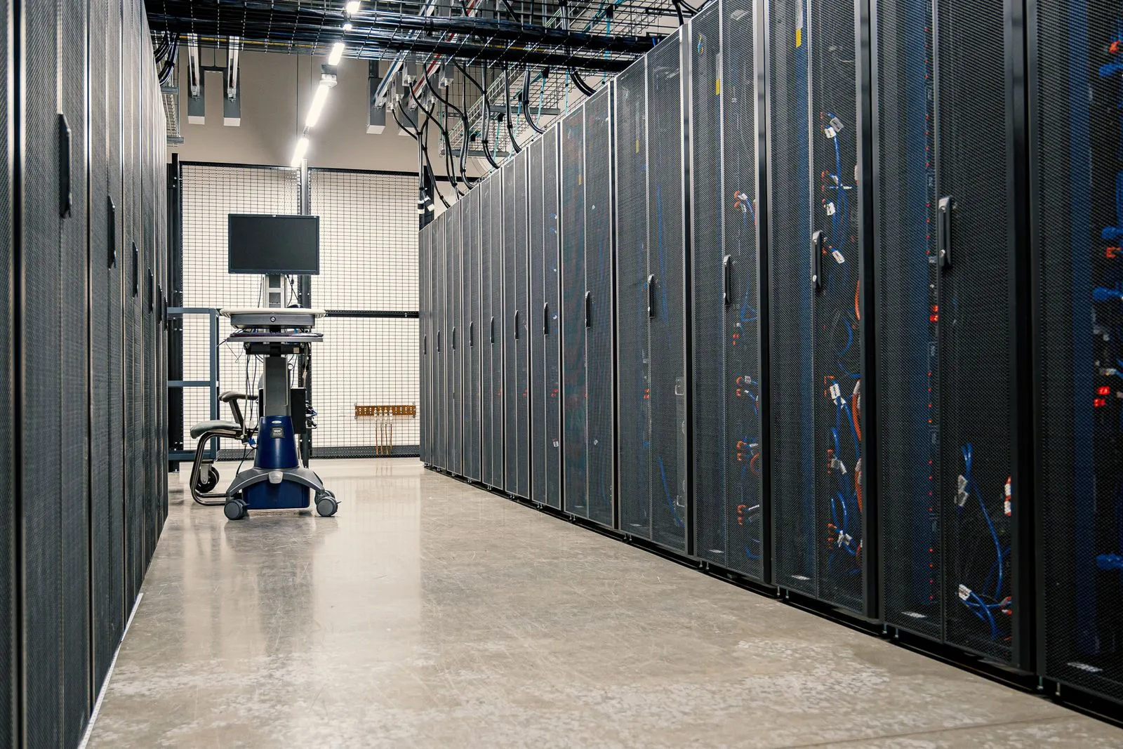 A modern data center aisle lined with server racks