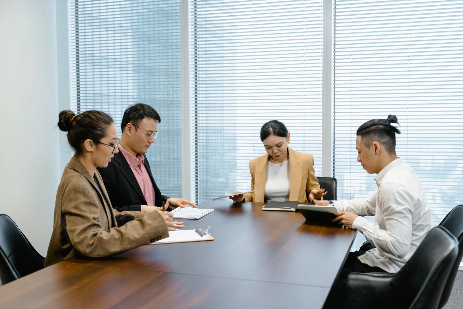 A project team collaborating around a table with a planning board